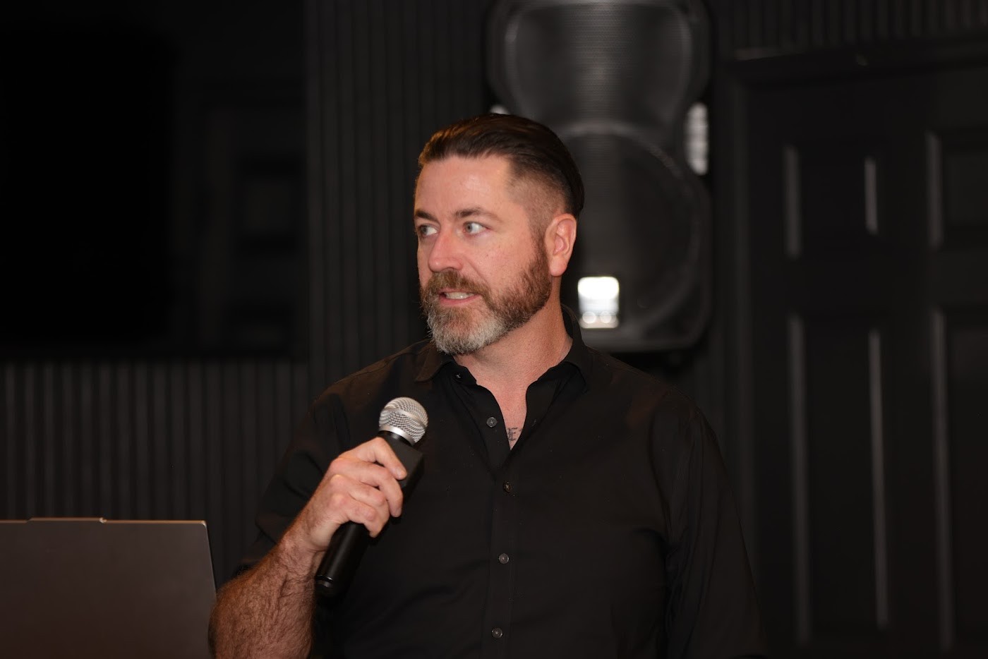 A practitioner speaking during a session at The Outpost